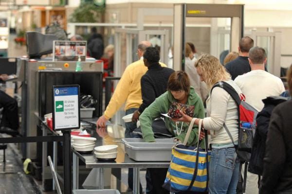 Travelers go through the security checkpoint at the Savannah/Hilton Head International Airport. (John Carrington/Savannah Morning News)