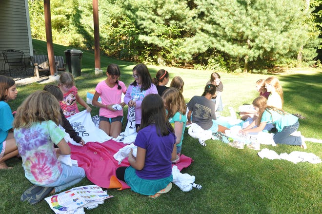You may have seen those dazzling tie-dye T-shirts celebrating Bolton's 275th Anniversary. Bolton's Girl Scout Troop 30214 got their hands bright and colorful as they created unique colorful masterpieces last spring, and another batch of 60 shirts this fall. If you didn't get a shirt the first time around, many more are available for purchase, including adult sizes. Stop by the Town Hall to pick your favorite size and color. The shirts will also be available at the Halloween Parade on Saturday, Oct. 26.