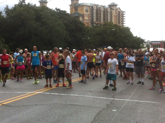 Almost 150 runners braved the remnants of Tropical Storm Karen and pounded the pavement during the Rodeo Run Saturday.