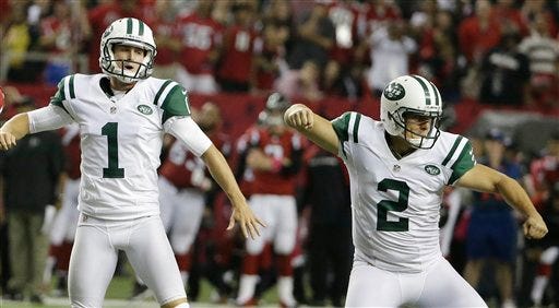 New York Jets kicker Nick Folk (2) celebrates his field goal with Ryan Quigley (1) against the Atlanta Falcons during the second half of an NFL football game, Monday, Oct. 7, 2013, in Atlanta. The Jets won 30-28. (AP Photo/David Goldman)