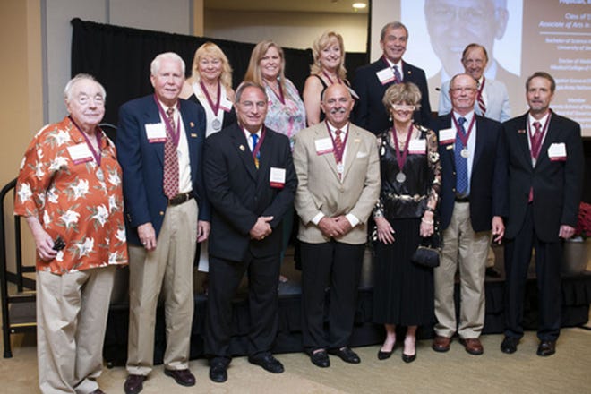 Armstrong Atlantic State University recognized the 2013 Notable Alumni at the Armstrong Alumni Awards Reception on Friday, Oct. 5. Front row, from left: Murray Silver, Spencer Hoynes, Michael Cohen, Thomas Beytagh, Sara Plaspohl, Gary Lackey and Dan Snope. Back row, from left: Florence Casket, Carolyn Moye-Bigelow, Kerry Coursey, Stratton Leopold and C.S. Burke, father of honoree Jon Burke. Not pictured: Jon Burke, David Dorondo, William Scarborough III and Nd Linda Wright.