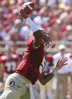 Florida State's Jameis Winston throws a pass against Maryland's defense in the first quarter on Saturday. Florida State shut out the 25th ranked Maryland team 63-0.