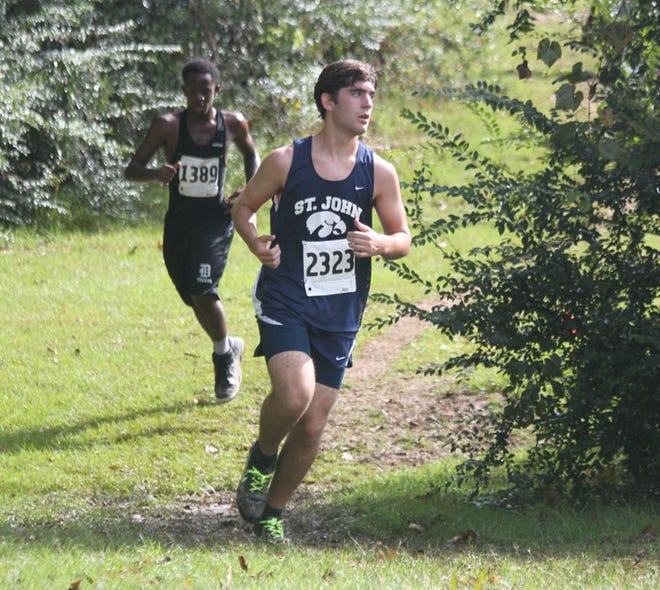 St. John's Dylan Hurst competes in the St. Joseph Academy Cross Country Invitational at Highland Road Park on Saturday morning. POST SOUTH PHOTO/Peter Silas Pasqua