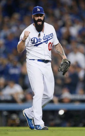 Los Angeles Dodgers pitcher Brian Wilson pumps his fist at the end of the top of the eighth inning against the Atlanta Braves in Game 4 of the National League divisional series Monday in Los Angeles.