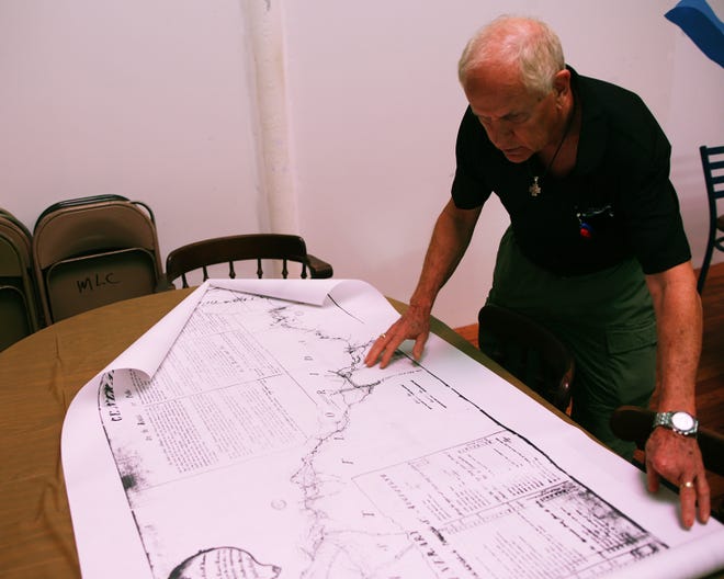 Bob Hurst, vice president of the Bay County Historical Society, points out features on a historical map of the Old Spanish Trail in Florida on Friday.