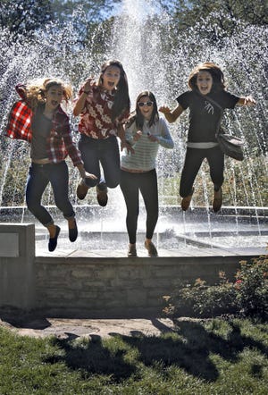 Columbus State Community College was closed yesterday to mark Columbus Day, so a few students went to the Whetstone Park of Roses for a picnic. From left are Abbey Nadulson, Melissa Weyers, Katie Mullen and Diana Kenney, who were happy to come across a fountain at the park. The women's original plan was to jump into the fountain. The official Columbus Day is Monday.