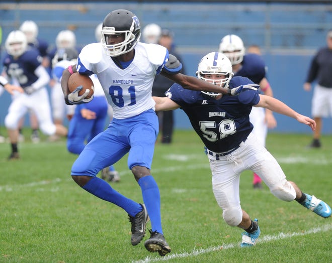 Randolph's Shemar Murray is pursued by Rockland defender Alec Donegan during the Bulldogs' 56-26 win on Saturday.