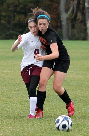 Doyle/Citizen photo

Portsmouth Christian's Julia Collopy, left, battles Farmington's Sara Jaycox for possession during Division IV action on Saturday in Dover.