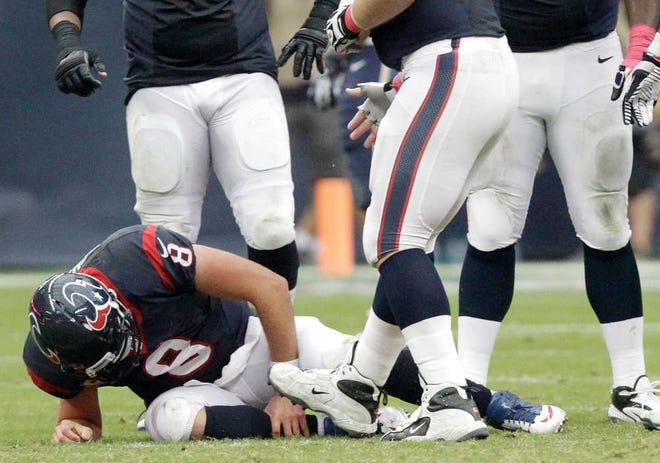 Houston Texans quarterback Matt Schaub (8) grabs his leg after being injured on2wld a sack by St. Louis Rams' Chris Long during the third quarter of an NFL football game Sunday, Oct. 13, 2013, in Houston, Texas. (AP Photo/Patric Schneider)
