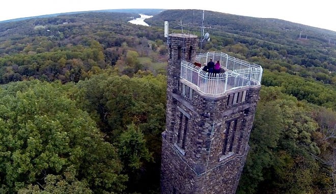 William and Melissa Carraway, who won a six-night stay at The Inn at Bowman's Hill after winning the Wheel of Fortune, take in the sweeping view from Bowman's Tower in Solebury Township. Photo by Steve Newbert
