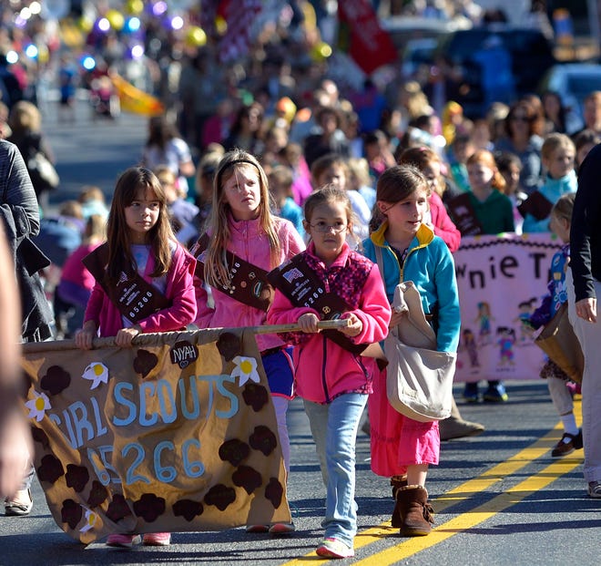 Girl Scouts march on Main Street during Southborough's Heritage Day parade on Monday.