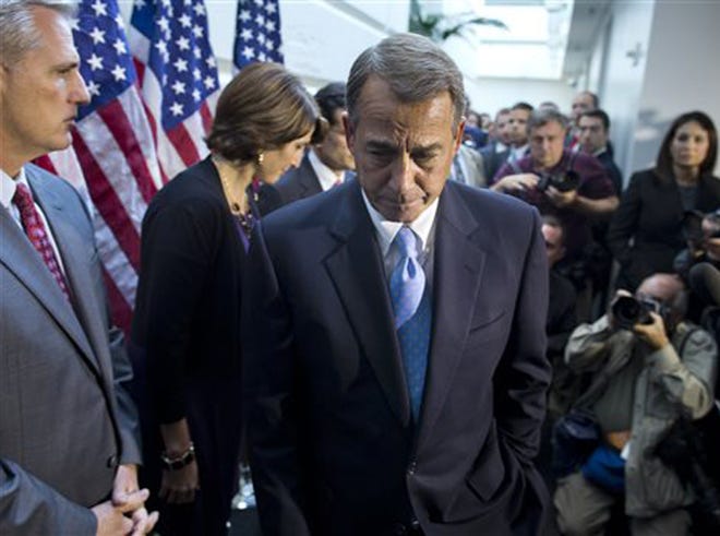 House Speaker John Boehner, R-Ohio, walks away from the microphone during a news conference after a House GOP meeting on Capitol Hill, Tuesday, Oct. 15, 2013, in Washington. House GOP leaders Tuesday floated a plan to fellow Republicans to counter an emerging Senate deal to reopen the government and forestall an economy-rattling default on U.S. obligations. But the plan got mixed reviews from the rank and file, and it was not clear whether it could pass the chamber.