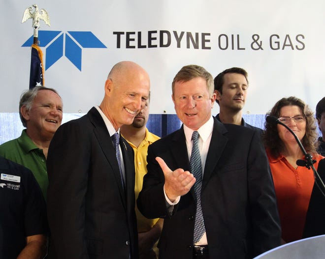 Gov. Rick Scott and Teledyne Oil & Gas President Mike Read dedicate the company's new technology development center in Daytona Beach on Tuesday.