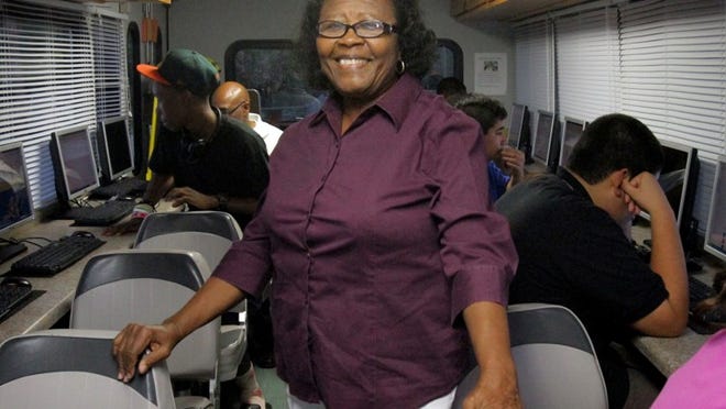 Estella Pyfrom, who spent her childhood as a migrant worker in the Glades picking beans, grew up to be a teacher and then spent a good chunk of her retirement on a full-size bus equipped with 17 computer stations. Now retired from education, she drives the  Brilliant Bu to schools and community centers and is personally closing the digital divide for kids at or below poverty level. (J. Gwendolynne Berry/The Palm Beach Post)