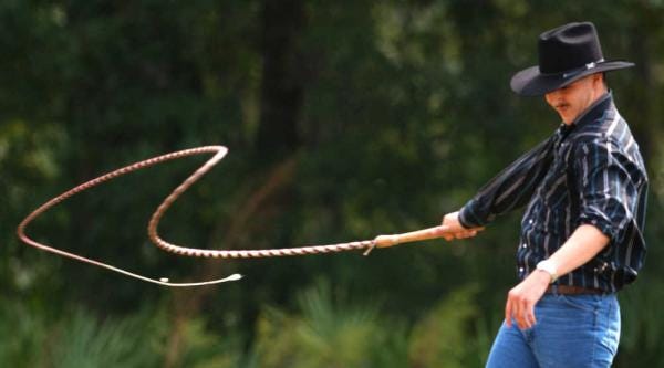 Forrest Noda practices with his bull whip Cracker Days in 2004. By PETER WILLOTT, peter.willott@staugustine.com