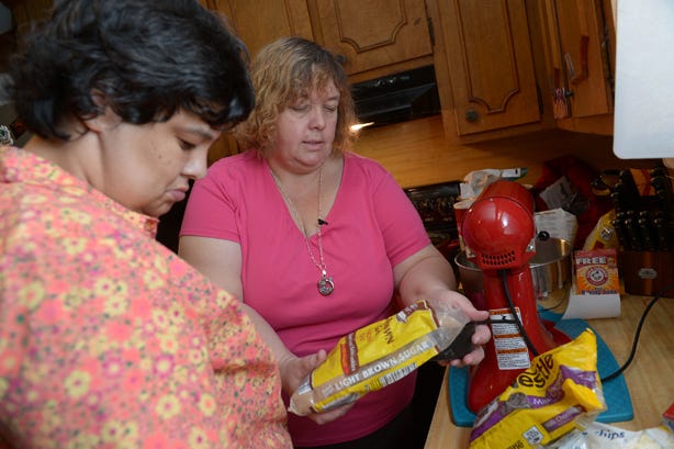 October Cook of the Month Jo Snow, right, bakes cookies with her niece, Tabitha Wright, at her Haw River home recently.