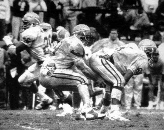 Associated Press Florida State's Dayne Williams (center) shovels the ball forward between the legs of LeRoy Butler (right) after Williams took the snap on a fake punt attempt in the final minutes against Clemson on Sept. 17, 1988.