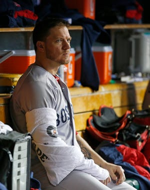 Red Sox pitcher Jake Peavy sits in the dugout during the fourth inning of Game 4 of the American League championship series on Wednesday night. Peavy gave up all seven runs in Boston's 7-3 loss.