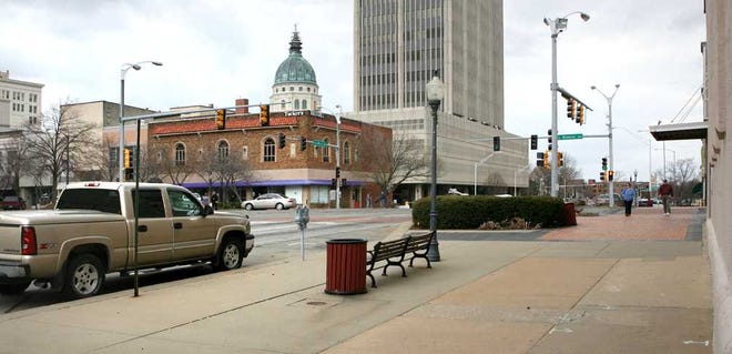 Designating Downtown Topeka, as seen here at the corner of 8th and Kansas, as a historic district could lead to increased investment and business development in the area, downtown merchants were told Thursday night by persons who had studied economic development in other cities with designated historical districts.