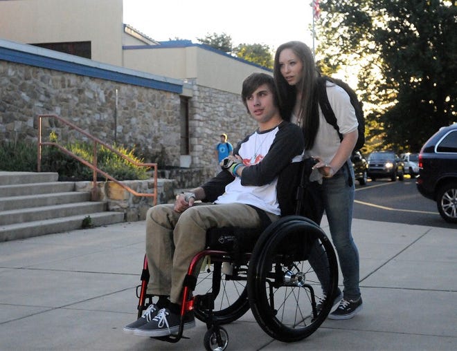 (file) Neshaminy High School student Matt Cruz and girlfriend of one year, Crystina Tierney of Levittown, pause before heading into school on the first day for Neshaminy students. Cruz was injured in a bus crash in Boston earlier this year that left him seriously injured; he is paralyzed from the chest down.