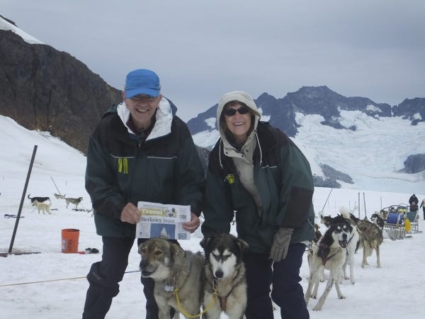 Bob and Judy Williams of Westerville get to know the sled dogs at Herbert Glacier north of Juneau, Alaska. Saying the state is awe-inspiring, the two cruisers encourage travelers to forgo cellphones and the Internet, which are expensive and intrusive.