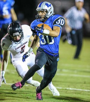 Bartram Trail's Anthony Young runs the ball pursued by Creekside's Matthew Rhodes (5) during the first half of high school football action at Bartram Trail High School, St. Johns, Fla., Friday, Oct. 18, 2013. By GARY McCULLOUGH, Special to The RECORD