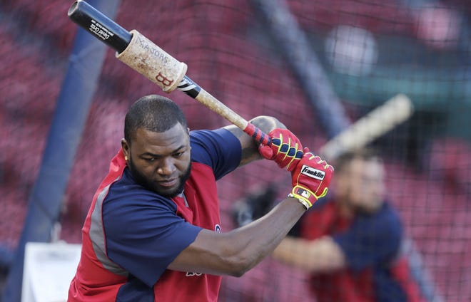 Boston Red Sox designated hitter David Ortiz warms up prior to taking batting practice during a workout at Fenway Park, Friday, Oct. 18, 2013, in Boston. The Red Sox are scheduled to host the Detroit Tigers in Game 6 of the American League championship series on Saturday.