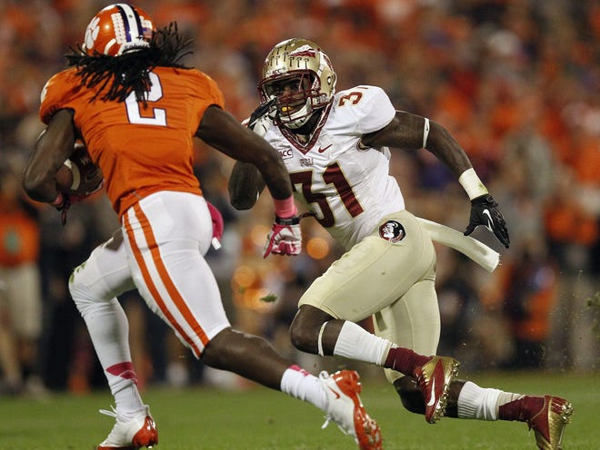 Clemson's Sammy Watkins (2) moves outside on Florida State's Terrence Brooks during the first half Saturday in Clemson, S.C.