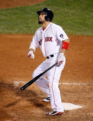 Boston Red Sox's Shane Victorino watches his grand slam against the Detroit Tigers in the seventh inning during Game 6 of the American League baseball championship series on Saturday, Oct. 19, in Boston.
