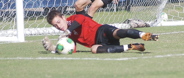Oklahoma Wesleyan University Eagle soccer goalie Luka Stojanovic makes a stop during Saturday’s rout of York (Neb.) College, in Bartlesville. The OKWU Eagles won, 8-1, to improve to 12-2 on the season and 6-0 at home. OKWU is set to play its regular season home finale Tuesday, when Central Baptist pays a visit. The women’s game is set for 1 p.m., followed by the men at 3 p.m. Mike Tupa/Examiner-Enterprise