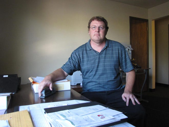 Greg Martin in his office at one of Tazwood Mental Health Center's residential services buildings. The office used to be a living space for clients of the residential program that was shut down in 2011 due to a lack of state funding.