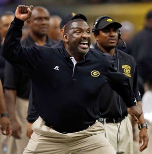 Grambling State coach Doug Williams reacts after a play against Southern University during the Bayou Classic in November 2012 in New Orleans. Grambling players say they are ending their boycott after speaking with former coach Doug Williams, who advised them to, "Go out there and play football."