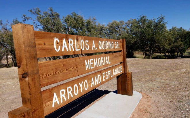 A sign marks the Carlos A. Quirino Sr. Memorial Arroyo and Esplanade in north central Lubbock Tuesday. (Stephen Spillman / AJ Media)