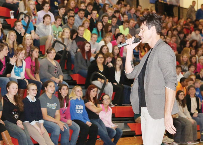 Singer Bill Ballenger, leader of the organization Break the Grey, discusses his own troubled past, suicide, depression, beauty and life-and-death decisions with Tecumseh students during an assembly Tuesday at Tecumseh High School. Similar assemblies are scheduled today and Thursday at other Lenawee County schools, and a free, public concert is at 7 p.m. Thursday, Oct. 24, at Adrian High School.