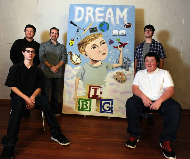 Nick Kane and Dustin Croteau (back), at left; and Victor DeFlaminio and Jeff Gagnon (back), at right, all seniors from The Paul J. Primavera Educational Center created a mural with art teacher David Acerra (center) for Bellingham's South Elementary School. They based the mural on the theme of childhood and learning given to them by South Elementary principal Eileen Tetreault. The mural will hang in the cafeteria.