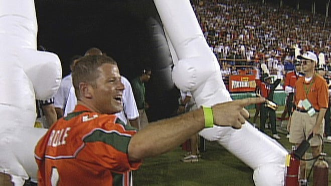 Former Miami booster Nevin Shapiro, shown before a Miami football game, while in prison for running a Ponzi scheme, gave the NCAA extensive documentation of egregious NCAA violations by the school. On Tuesday, Oct. 22, 2013, the NCAA ruled on the case, taking scholarships and handing down stiff penalties to former UM coaches.