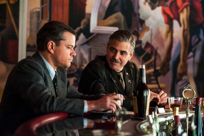 This film image released by Columbia Pictures shows Matt Damon, left, and George Clooney in "The Monuments Men." A spokesman for Sony Pictures said Wednesday, Oct. 23, 2013, that the film will now be released in the first quarter of next year, instead of its planned release date of Dec. 18. "Monuments Men," which Clooney directed, co-wrote and stars in, had been expected to be a top Oscar contender. (AP Photo/Columbia Pictures - Sony, Claudette Barius)