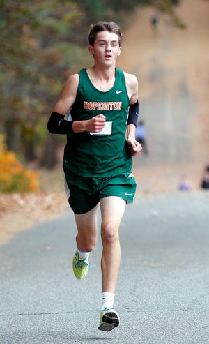 Hopkinton's Evan Park takes first place in the boys cross country meet against Ashland at the State Park in Ashland.