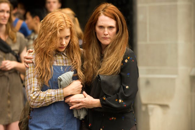 This photo released by Sony Pictures shows Chloe Moretz, left, and Julianne Moore in a scene from the horror film "Carrie."