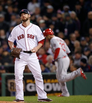 Red Sox relief pitcher Craig Breslow reacts after walking Daniel Descalso during the seventh inning of Game 2 of the World Series.