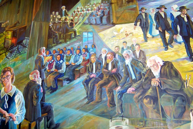 This portion of the mural at the Amish and Mennonite Heritage Center at Berlin depicts an Amish church service, with the men and women seated apart.