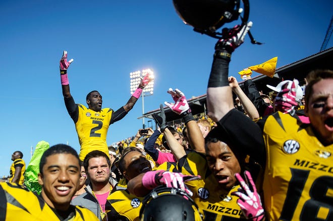 Missouri players celebrate with fans after last Saturday’s 36-17 victory over Florida. The No. 5 Tigers take on No. 20 South Carolina Saturday night on Faurot Field.