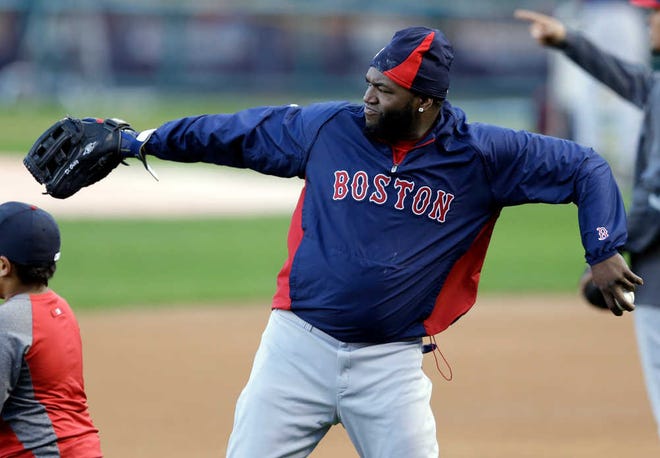 Boston Red Sox's David Ortiz throws during baseball practice Friday, Oct. 25, 2013, in St. Louis. The Red Sox and St. Louis Cardinals are set to play Game 3 of the World Series on Saturday in St. Louis. (AP Photo/Jeff Roberson)