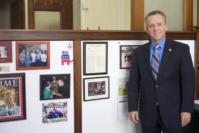 State Rep. Jeffrey Roy, D-Franklin, with memorabilia in his State House office.