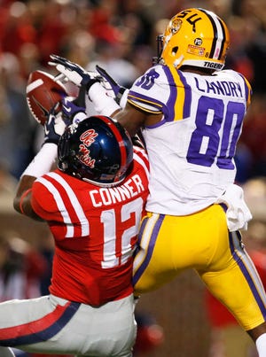 Mississippi defensive back Tony Conner (12) breaks up a pass intended for LSU wide receiver Jarvis Landry (80) in the second half of an NCAA college football game at Vaught-Hemingway Stadium in Oxford, Miss., Saturday, Oct. 19, 2013. Mississippi won 27-24. (AP Photo/Rogelio V. Solis)
