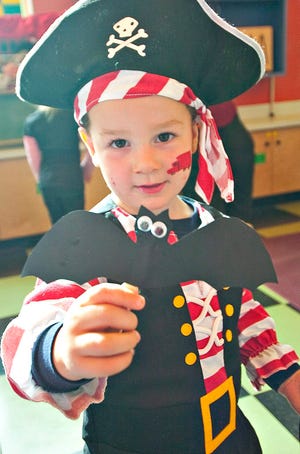 Spooky pirate Brant Bingham, 2, makes a bat puppet during the New Hampshire Children’s Museum’s Not-So-Spooky Spectacular in Dover Saturday.