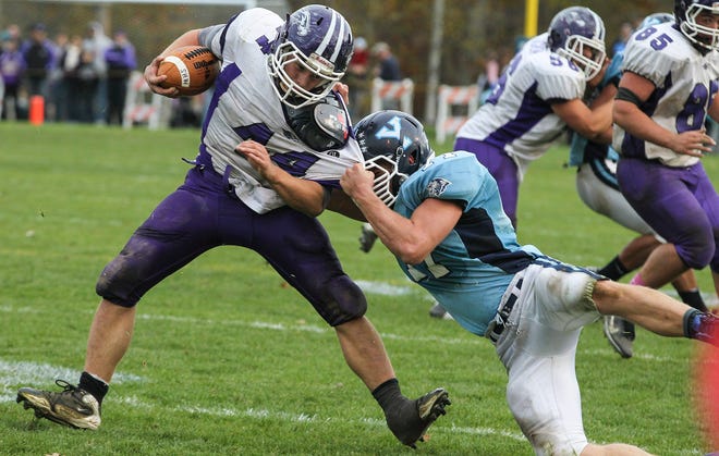 Marshwood’s Brett Gerry, left, is taken down by York’s Zachary Handley during the fourth quarter of Western Maine Class B action on Saturday in York.