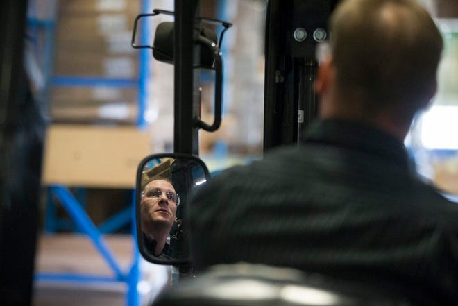:“It's been a big difference in lifestyle, but it is what it is. What I've learned from this is to just be grateful for what you got. Don't be greedy”: Dave Frueh of Rockford drives a forklift while picking orders for shipping Thursday, Oct. 24, 2013, at Southern Imperial in Rockford.