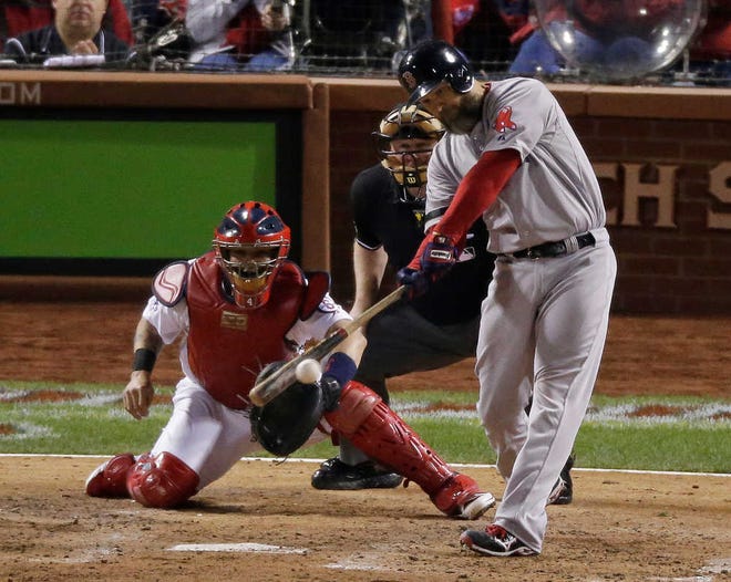 Boston Red Sox's David Ross hits an RBI double during the seventh inning of Game 5 of baseball's World Series against the St. Louis Cardinals Monday, Oct. 28, 2013, in St. Louis. (AP Photo/Charlie Riedel)