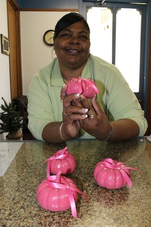 Judy O'Bear, top, of the Iberville Parish Assessor's Office, along with the Mary Bird Perkins Cancer Center is offering painted pink pumpkins for the first-time ever in support of Breast Cancer Awareness Month in Iberville Parish. 
POST SOUTH PHOTO/Peter Silas Pasqua